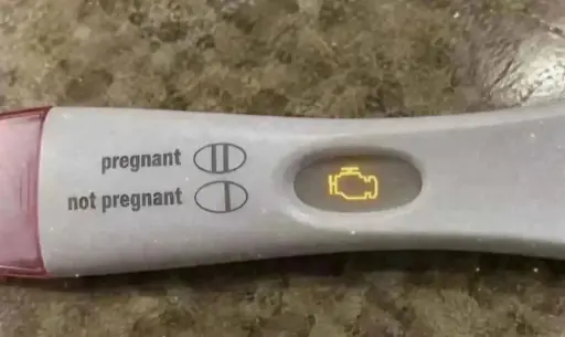 A pregnancy test with the check engine light