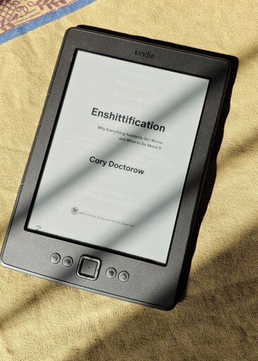  A kindle showing Enshittification book. 