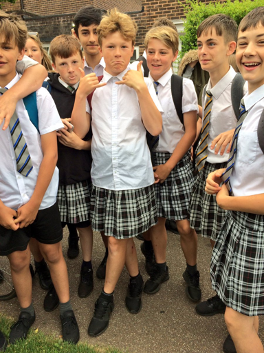 School banned boys from wearing shorts during a heatwave, so they wore skirts.